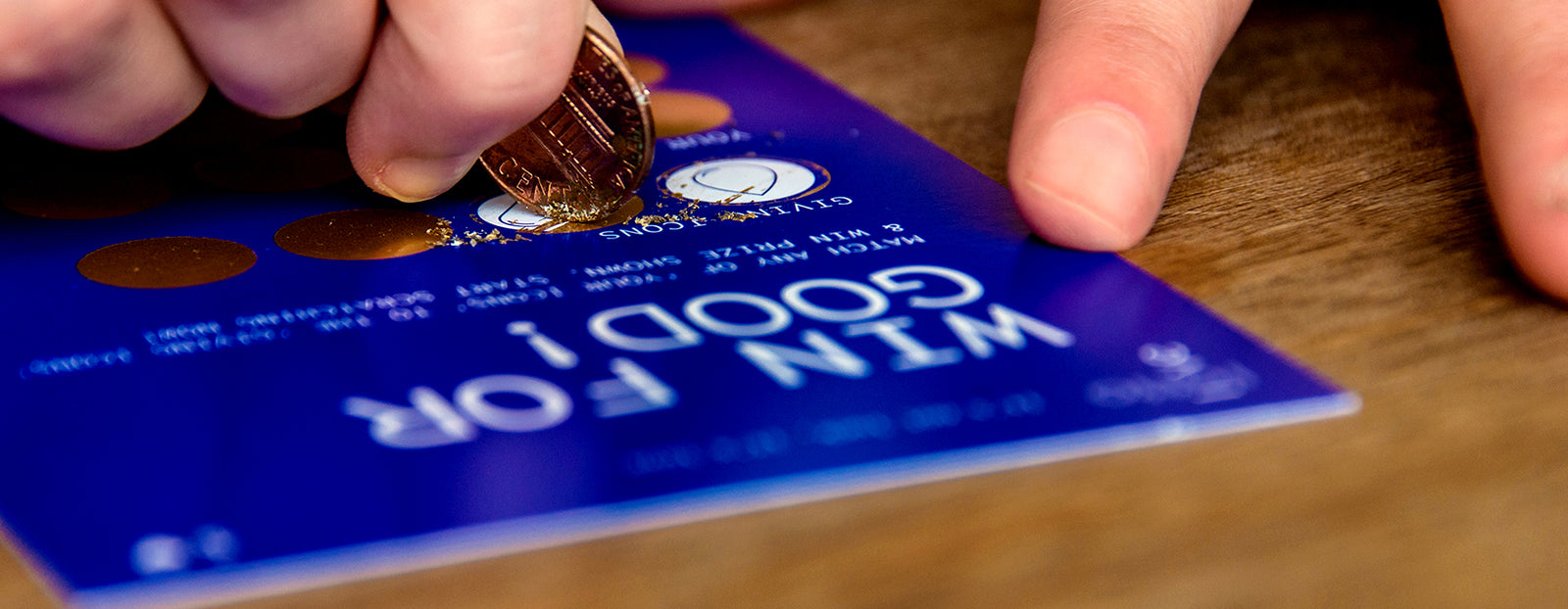 Penny scratching Blue LottoLove Card